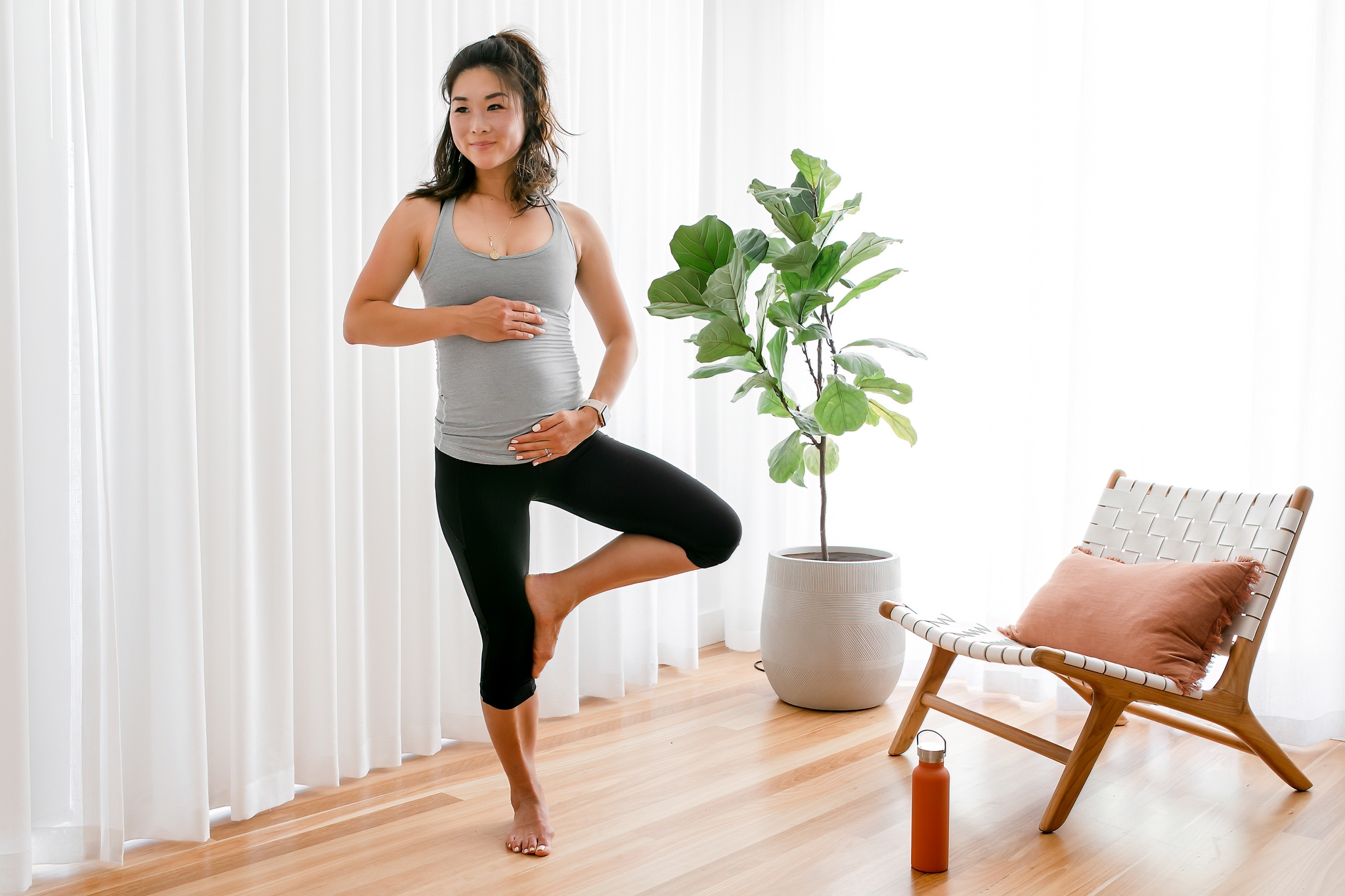 5 weeks pregnant mom-to-be doing stretches