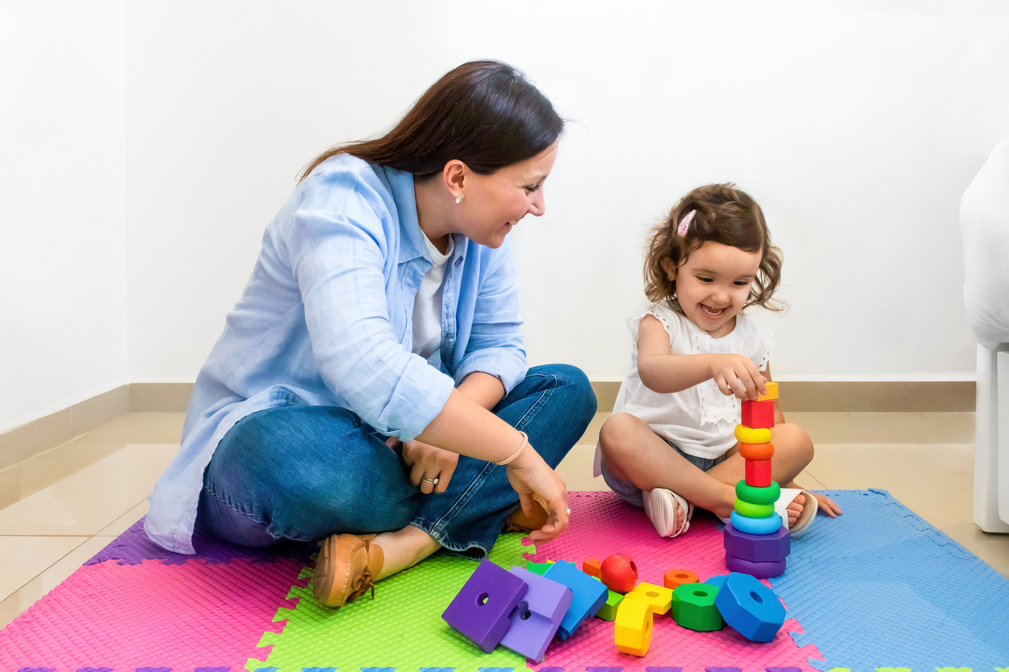 toddler daycare adjustment: Mom plays with toddler